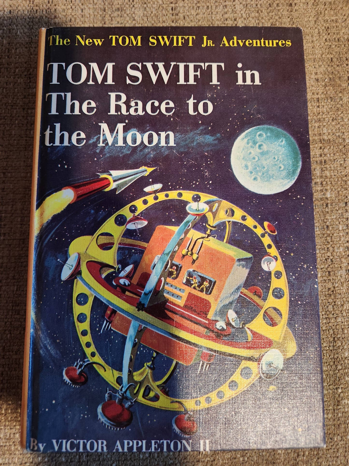 "Tom Swift in The Race to the Moon", by Victor Appleton II (Yellow Spine)