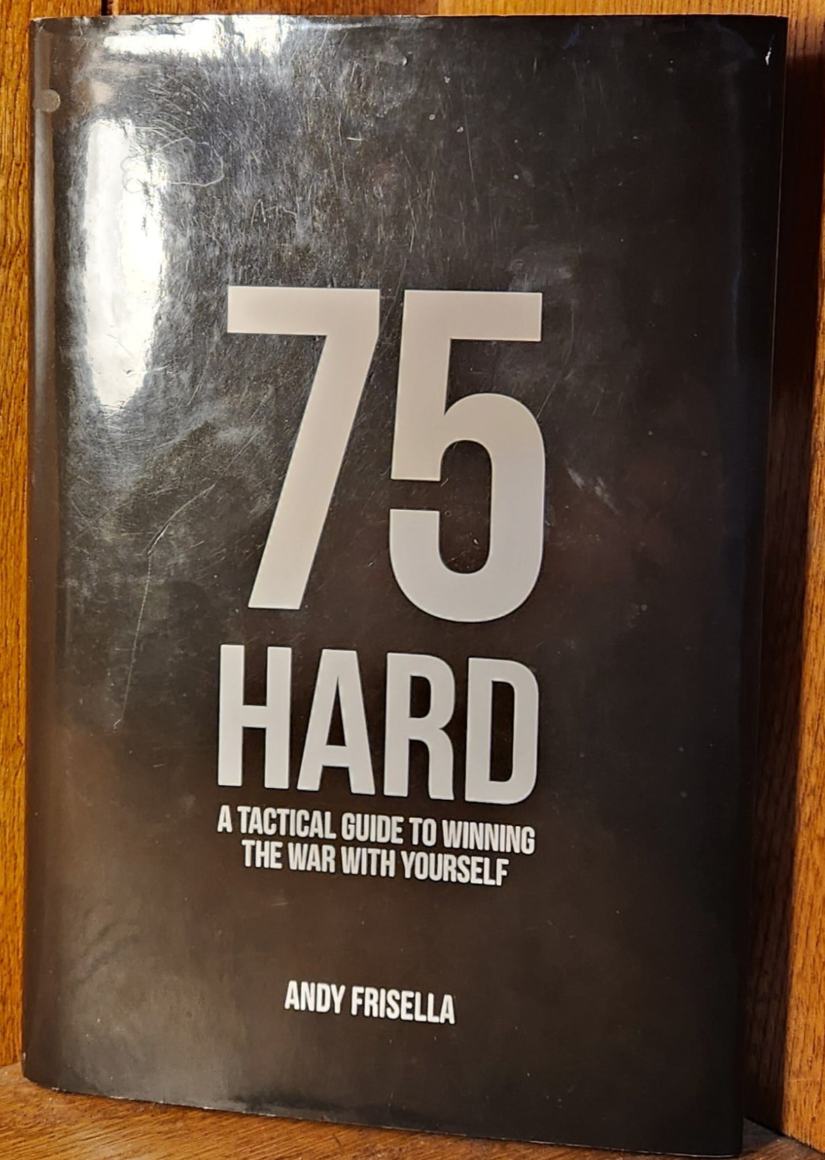 "75 Hard: A Tactical Guide to Winning the War with Yourself" by Andy Frisella - Dead Tree Dreams Bookstore