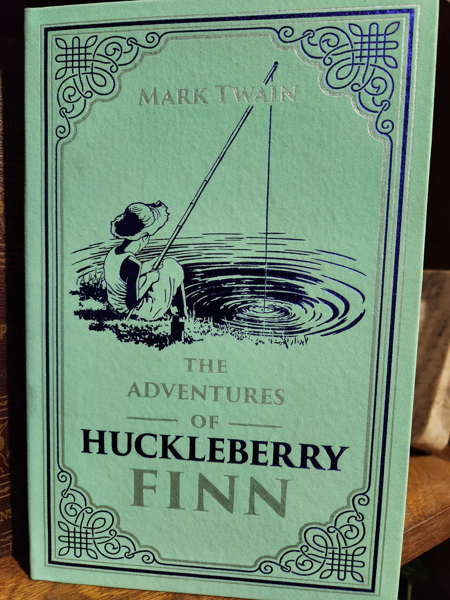 "The Adventures of Huckleberry Finn" by Mark Twain