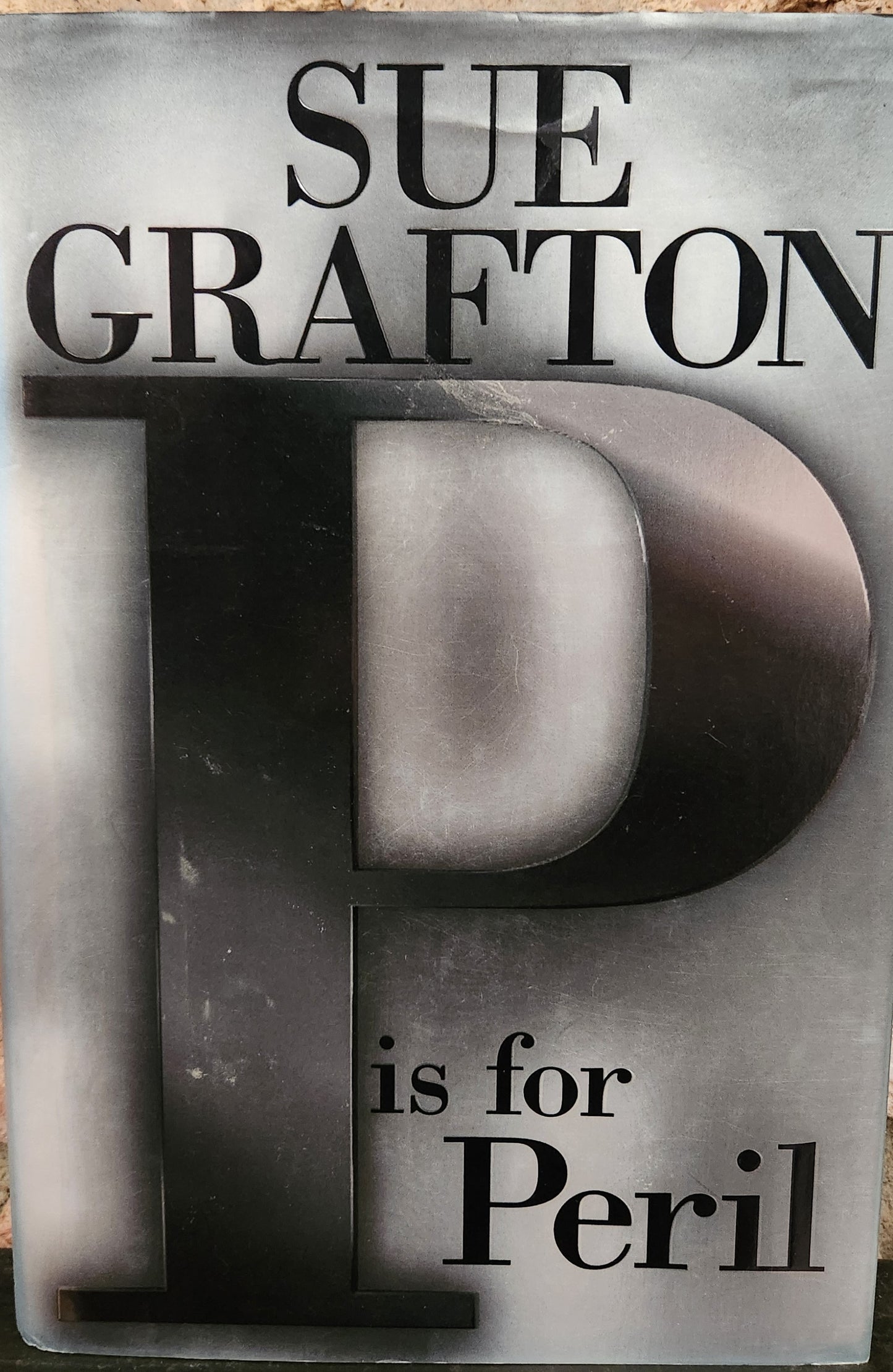 "P is for Peril" by Sue Grafton (Kinsey Millhone #16)